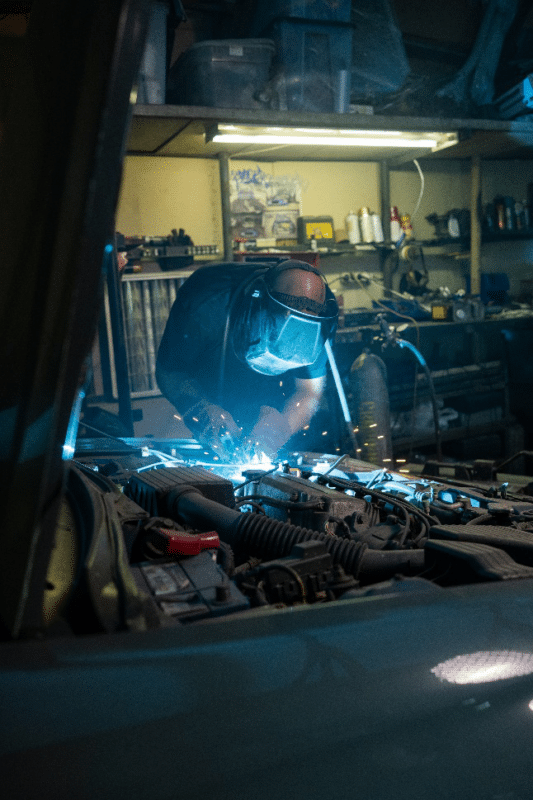a man repairing a car